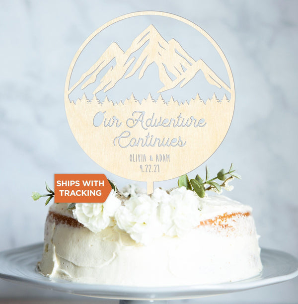 Custom Name Our Adventure Continues Wedding Cake Topper